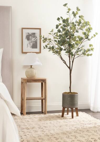 Kate and Laurel 6ft. Eudora Faux Eucalyptus Tree in Gavri Wood & Metal Planter